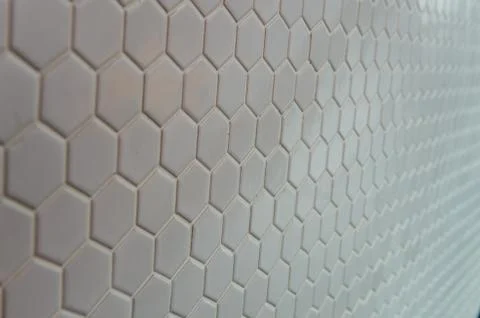 A simple white texture pattern of hexagons as a background Stock Photos