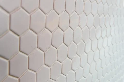 A simple white texture pattern of hexagons as a background Stock Photos