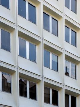 Simple windows on modernist facade of white colour with minimal geometric l.. Stock Photos