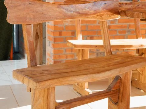 Simple wooden chair with solid construction and natural finish Stock Photos