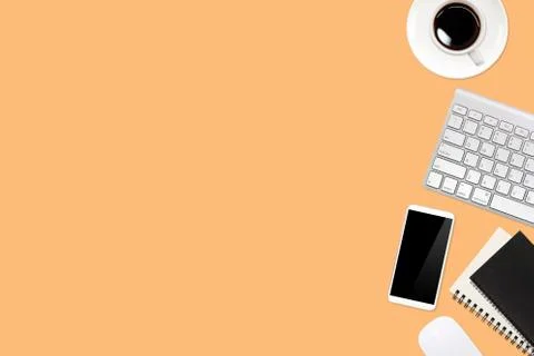 Simple workspace technology orange table with laptop computer Stock Photos