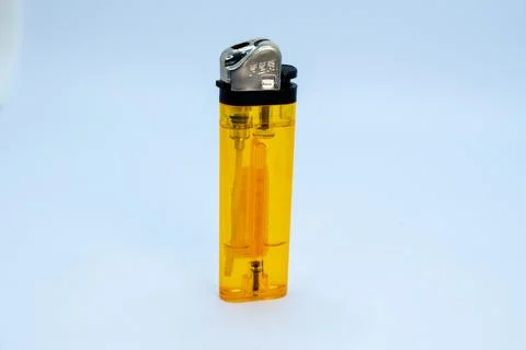 A simple yellow lighter Foto stock