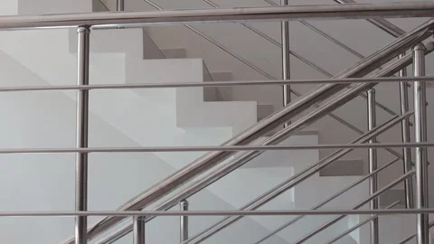A simple yet elegant white staircase featuring a clock at the top, perfect .. Stock Footage 342175308