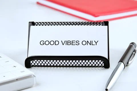 A simple yet uplifting desk organizer displays a good vibes only message, set Stock Photos