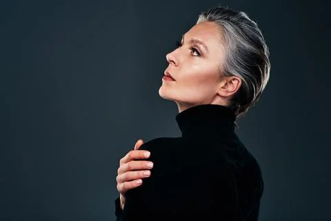 Simplicity is the soul of modern elegance. Studio shot of a beautiful mature Stock Photos