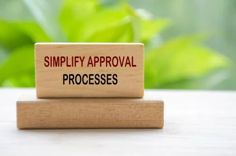 Simplify Approval Processes text on wooden blocks representing continuous I.. Stock Photos