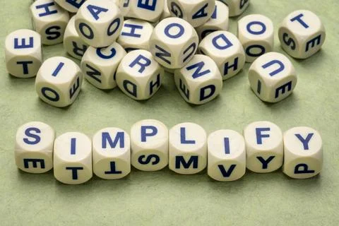 Simplify concept in letter dices simplify reminder, pragmatic, declutter o... Stock Photos