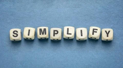 Simplify concept in wooden dices simplify reminder, pragmatic, declutter o... Stock Photos