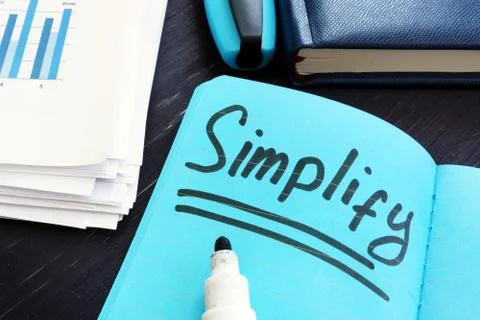 Simplify written on a page. Simplicity concept. Stock Photos