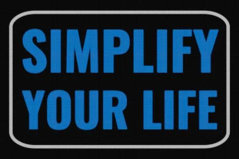 Simplify Your Life  text on dark screen Stock Photos