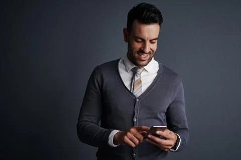 Simplifying business tasks with smart tech. Studio shot of a stylish young Stock Photos