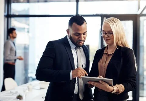 Simplifying collaborations with smart tech. a young businessman and Stock Photos