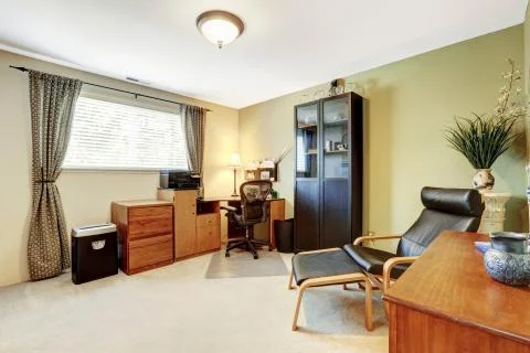 Simplistic home office white interior with carpet floor and beige walls. Stock Photos
