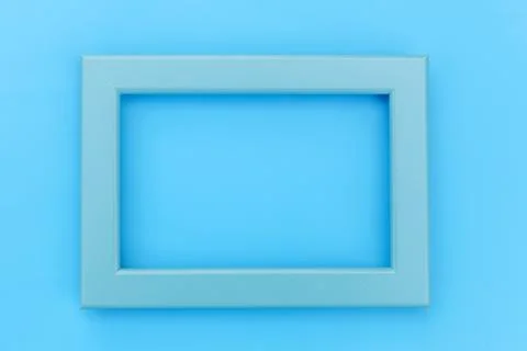 Simply design with empty blue frame isolated on blue pastel colorful backgrou Stock Photos