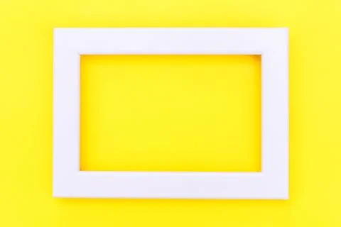 Simply design with empty pink frame isolated on yellow colourful trendy backg Stock Photos