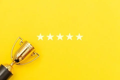 Simply flat lay design winner or champion gold trophy cup and 5 stars ratin.. Stock Photos