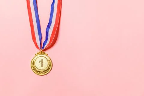 Simply flat lay design winner or champion gold trophy medal isolated on pin.. Stock Photos