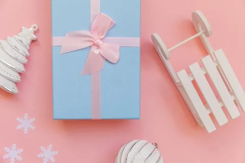 Simply minimal composition winter objects ornament ball fir tree sled gift bo Stock Photos