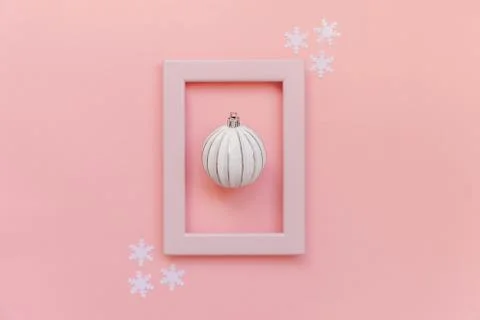 Simply minimal composition winter objects ornament ball in pink frame isolate 스톡 사진