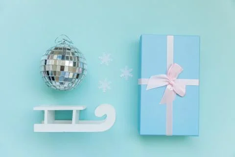 Simply minimal composition winter objects ornament ball sled gift box isolate Stock Photos