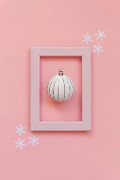 Simply minimal composition winter objects ornament ball in pink frame isolate Stock Photos