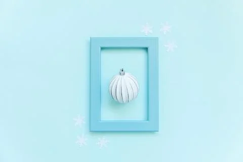 Simply minimal composition winter objects ornament ball in blue frame isolate Stock Photos
