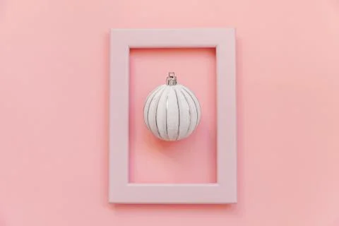 Simply minimal composition winter objects ornament ball in pink frame isolate 스톡 사진