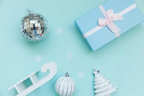 Simply minimal composition winter objects ornament sled fir tree ball gift bo Stock Photos