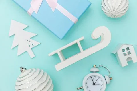 Simply minimal composition winter objects ornament sled fir tree ball gift bo Stock Photos