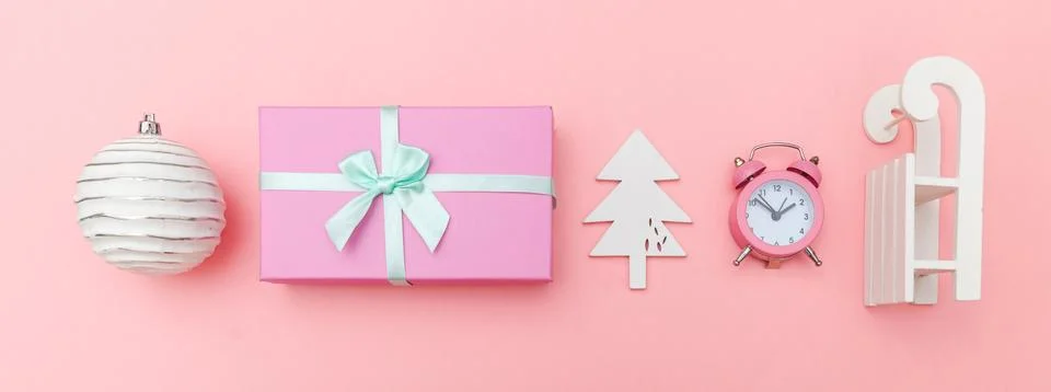 Simply minimal composition winter objects ornament sled fir tree ball gift bo Stock Photos