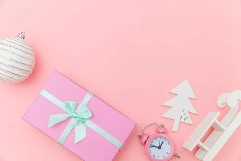 Simply minimal composition winter objects ornament sled fir tree ball gift bo Stock Photos