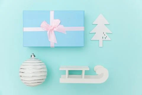 Simply minimal composition winter objects ornament sled fir tree ball gift bo Stock Photos