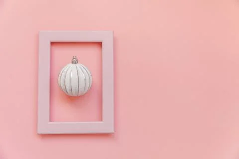 Simply minimal composition winter objects ornament ball in pink frame isolate 스톡 사진