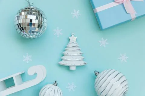 Simply minimal composition winter objects ornament sled fir tree ball gift bo Stock Photos