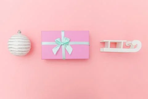 Simply minimal composition winter objects ornament sled fir tree ball gift bo Stock Photos