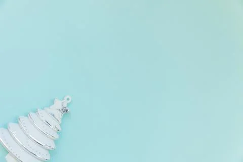 Simply minimal composition winter objects ornament fir tree isolated on blue Stock Photos