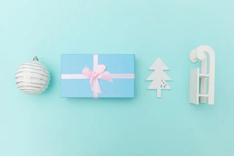 Simply minimal composition winter objects ornament sled fir tree ball gift box Stock Photos