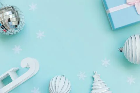 Simply minimal composition winter objects ornament sled fir tree ball gift bo Stock Photos
