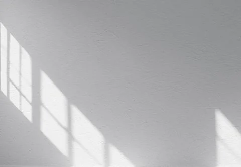 Simply white wall with reflection by window during sunny day. Space for text. Stock Photos