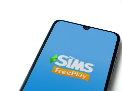 The Sims FreePlay app launch screen on smartphone on white background Stock Photos