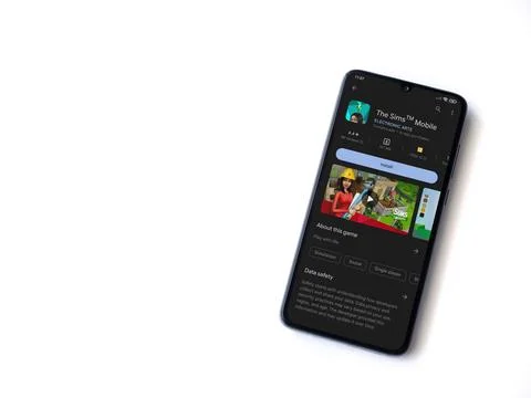 The Sims Mobile app play store page on smartphone on white background Foto stock