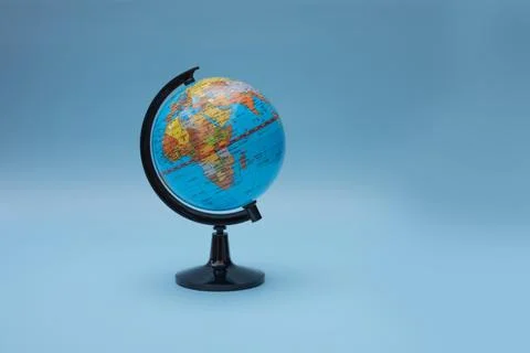 A simulated globe for learning on a blue background. Stock Photos