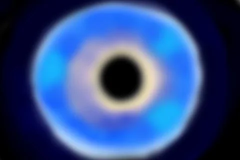 Simulation of a black hole in deep sidereal space with azure and blue tones a Stock Photos