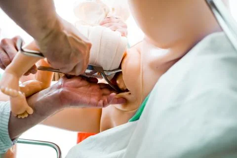 Simulation of complicated breech birth on mannequin simulator using birth Stock Photos