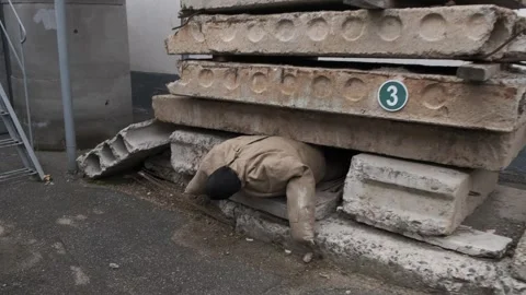 Simulation of a disaster survival scenario with a training dummy trapped un.. Stock Footage 329685712