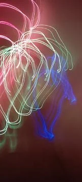 Simulation of galaxy light motion of stars in dark background, future energy Stockfoto's