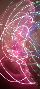 Simulation of galaxy light motion of stars in dark background, future energy Stockfoto's