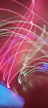 Simulation of galaxy light motion of stars in dark background, future energy 写真素材