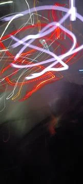 Simulation of galaxy light motion of stars in dark background, future energy 写真素材