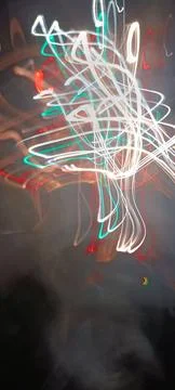 Simulation of galaxy light motion of stars in dark background, future energy 写真素材